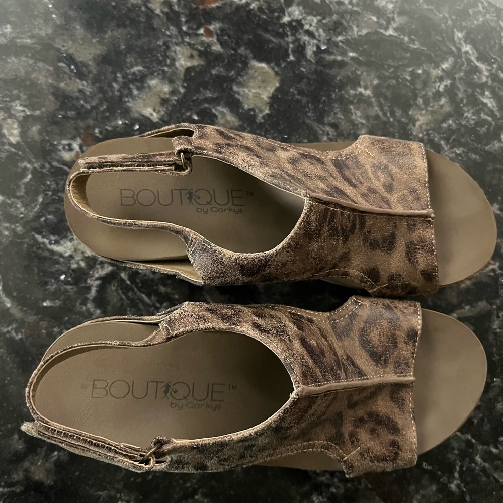 Corkys gently used size 7 Cheetah Print wedge  sandals. Super cute!!